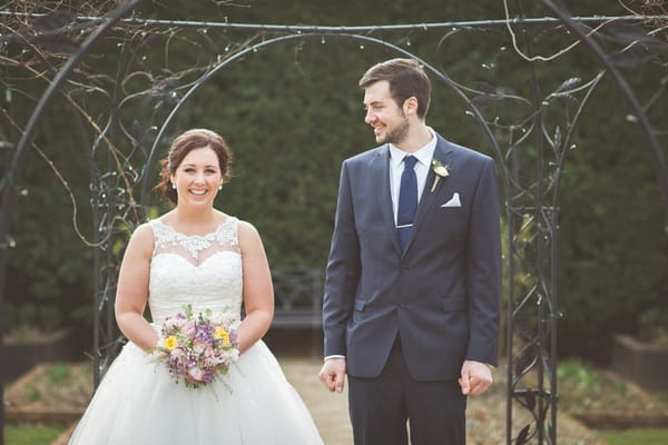 Groom looking at bride