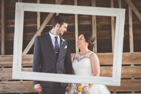 Bride and groom inside picture frame