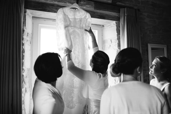 Bride taking wedding dress