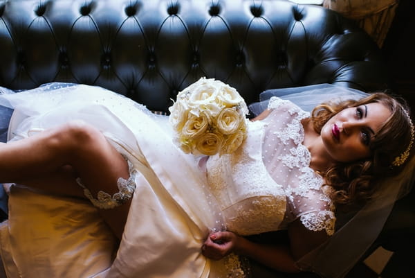 1950s bride laying on couch