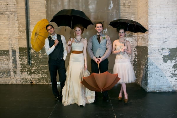 Bridal party with umbrellas