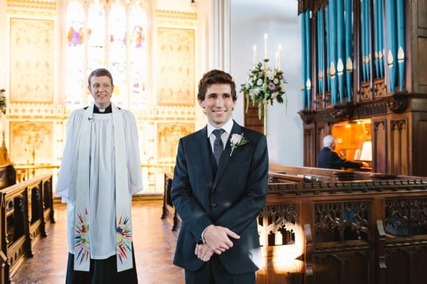 Groom at altar