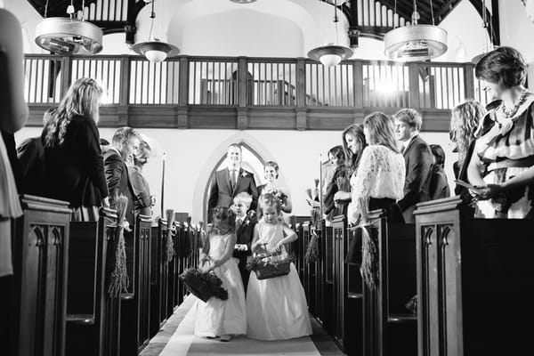 Flower girls walking down aisle