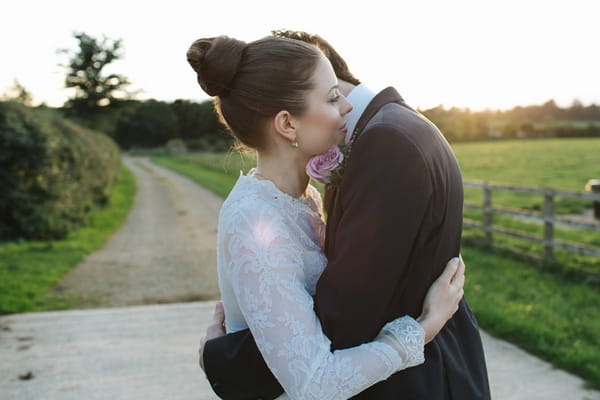 Bride and groom hugging