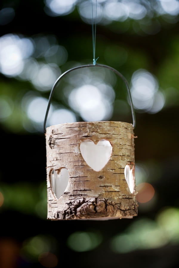 Wooden tealight holder hanging from tree