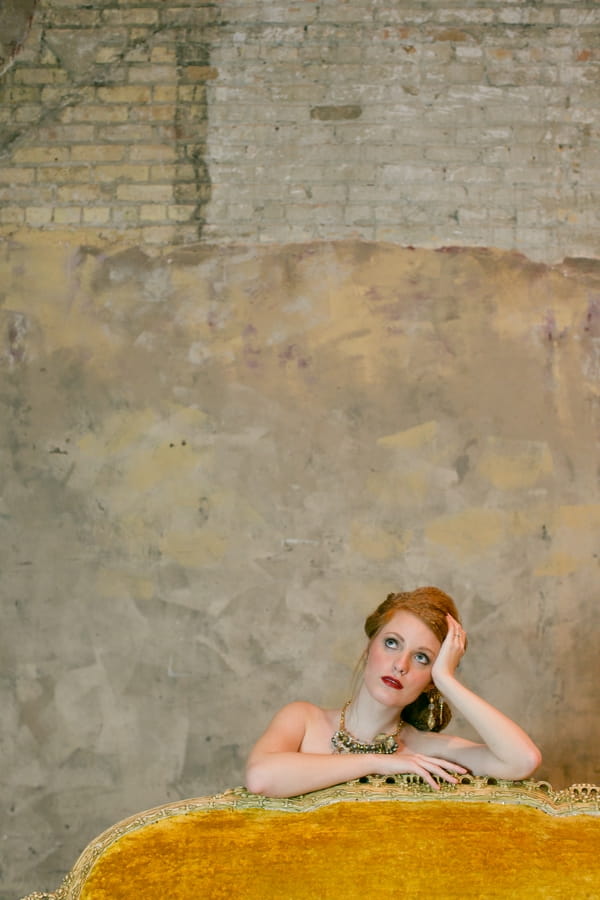 Bride leaning on back of couch