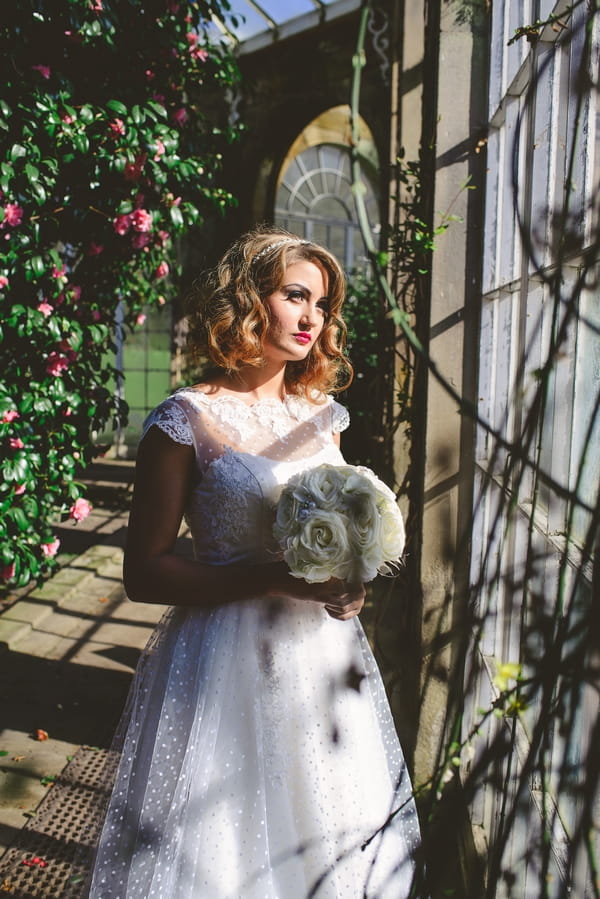 1950s bride holding bouquet