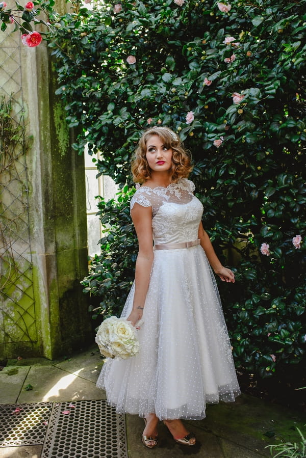 1950s bride holding bouquet