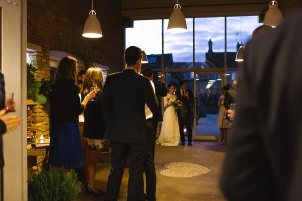 Bride and groom enter wedding breakfast