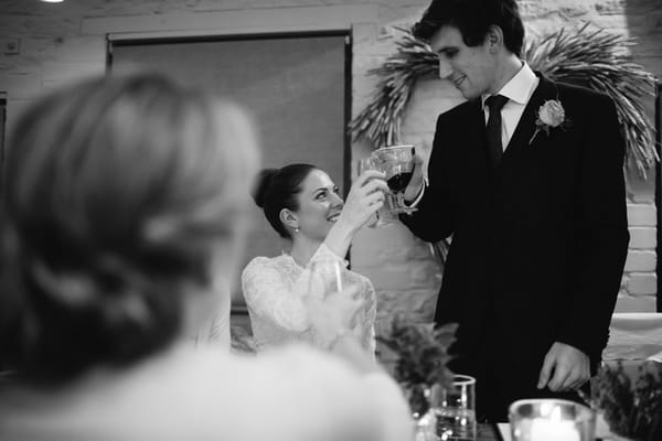 Bride and groom cheers