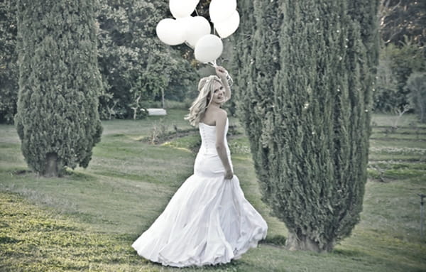Bride holding balloons
