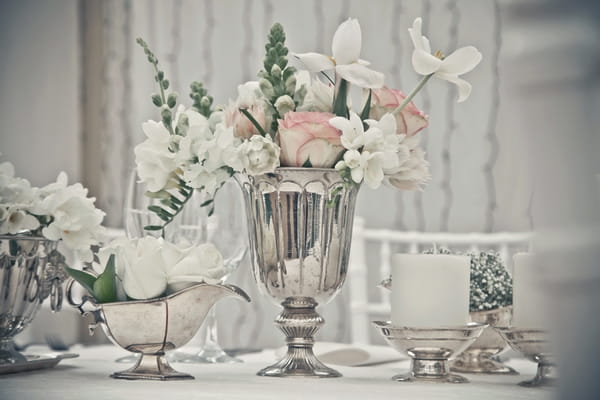 Silver vase of wedding table flowers