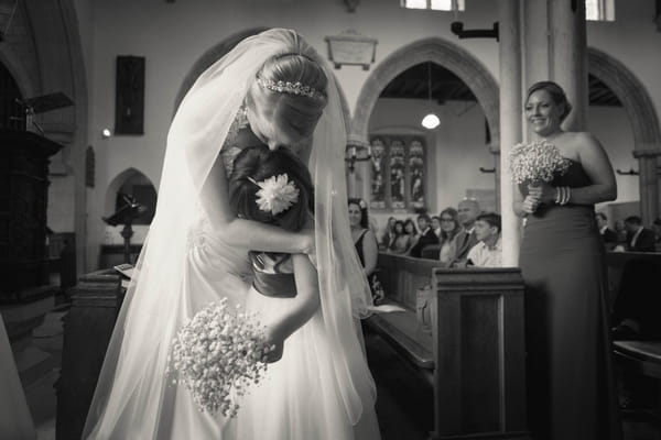 Bride hugging girl - Picture by Linus Moran Photography