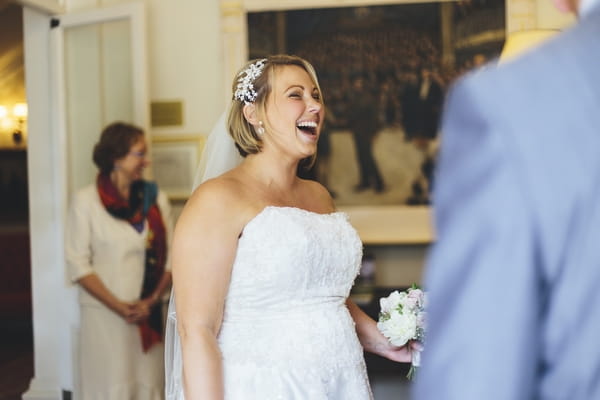 Bride laughing in wedding ceremony
