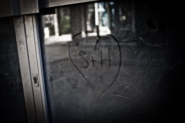 S + H love heart drawn on window