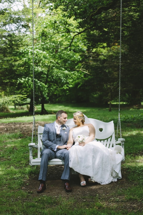 Bride and groom on swing
