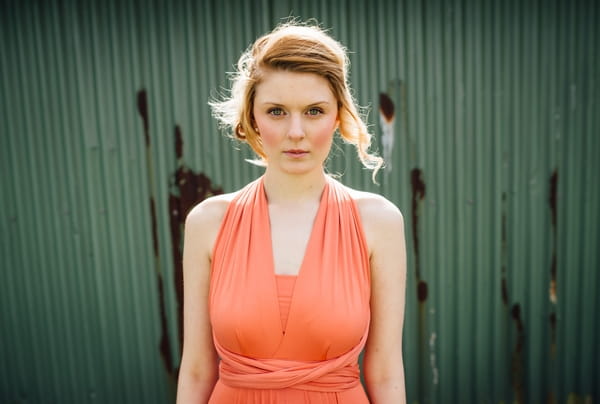 Bridesmaid wearing coral dress