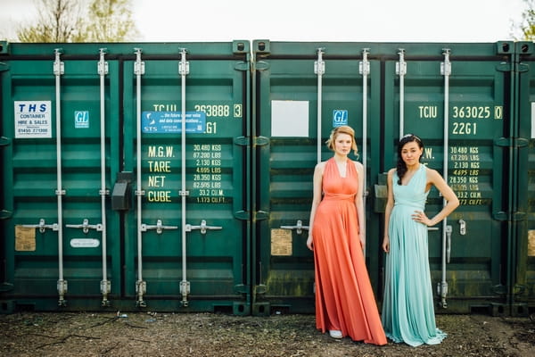 Bridesmaids in coral and blue dresses