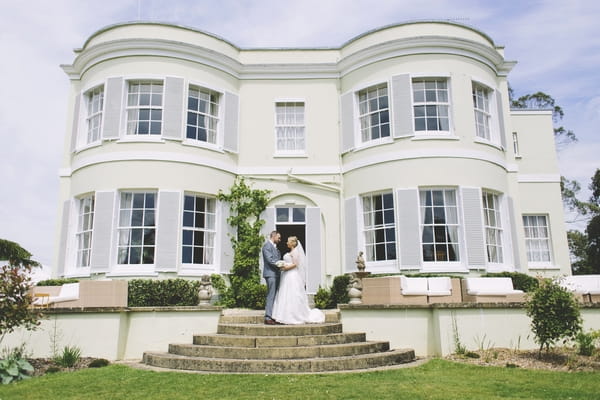 Bride and groom outside Deer Park Country House Hotel