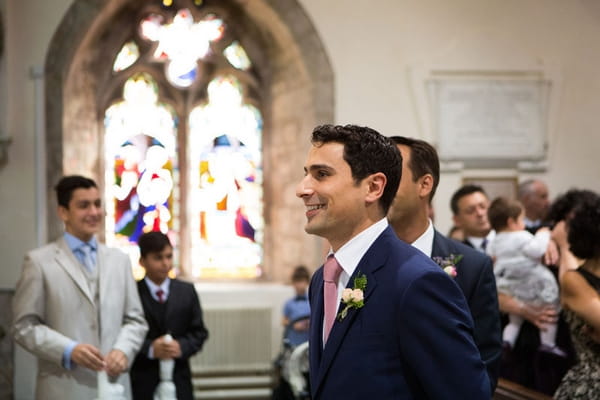 Groom waiting in church for bride