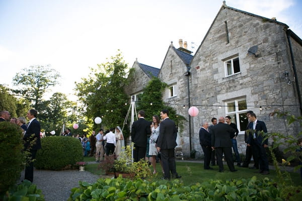 Wedding guests outside venue