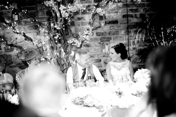 Groom laughing at speech