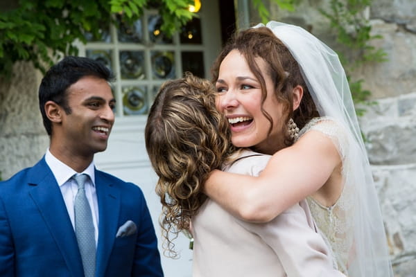 Bride hugging lady