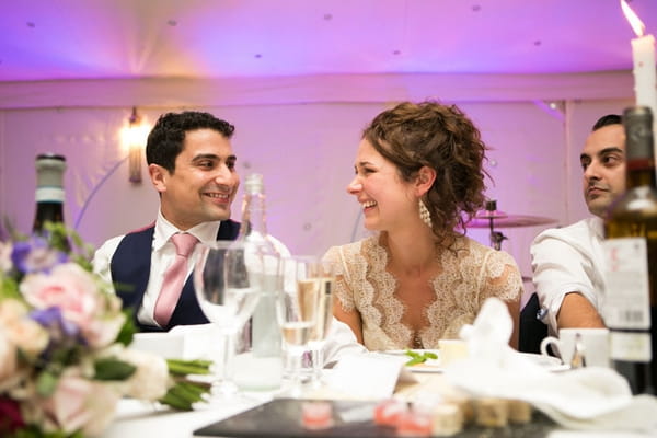 Bride and groom smiling at each other