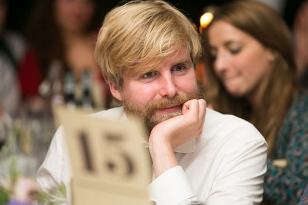 Wedding guest listening to speech