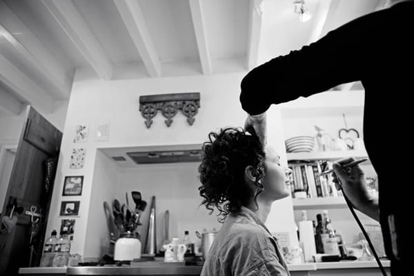 Bride having make-up done