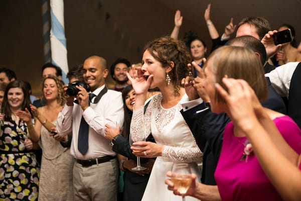 Guests watching Greek wedding dance