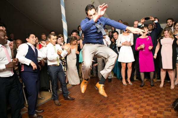 Man jumping in air on dance floor