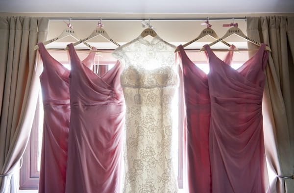 Wedding dress and bridesmaid dresses hanging