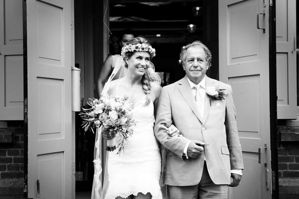 Bride walking with father