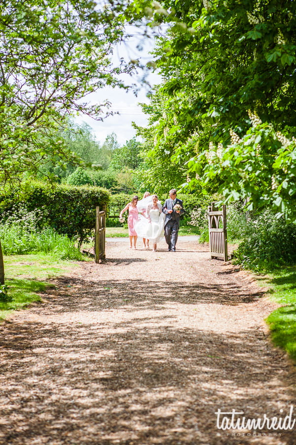 Walking to wedding down country lane