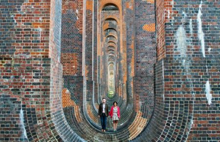 Couple standing in Ouse Valley Viaduct