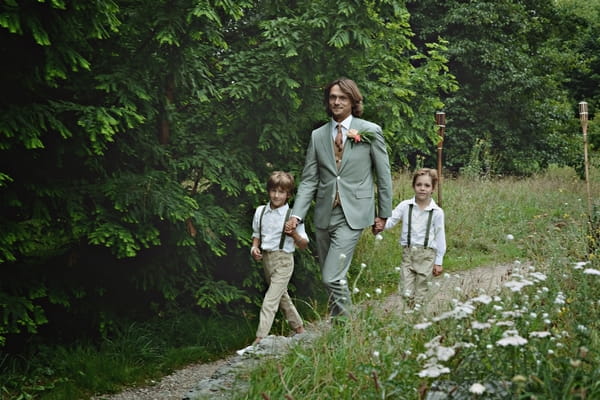 Groom walking with young boys