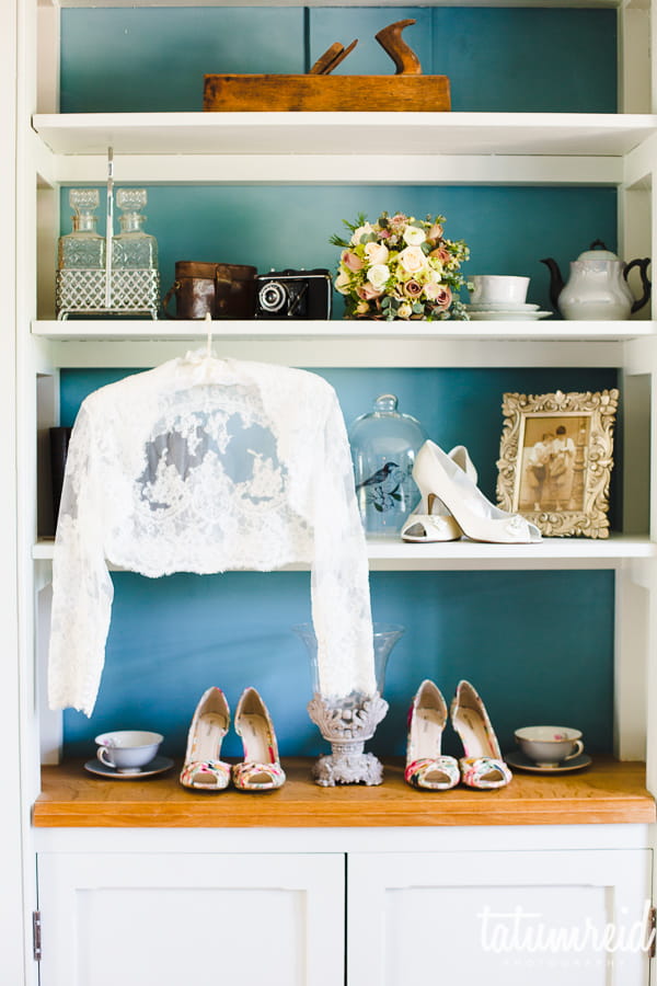 Wedding shoes and jacket on shelf