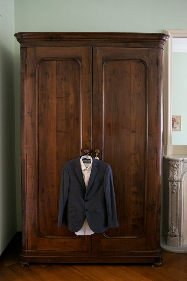 Suit jacket hanging on wardrobe