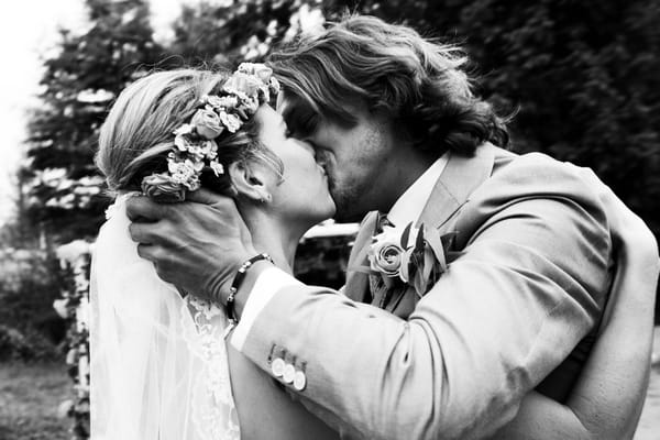 Bride and groom kiss