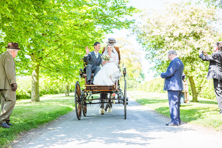 Bride and groom on horse and cart