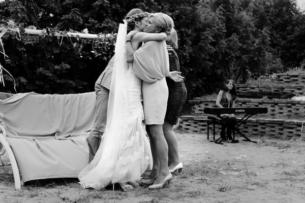 Bride hugging lady