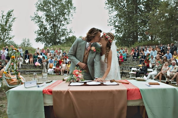 Bride and groom signing register