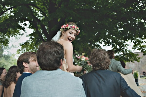 Bride being carried