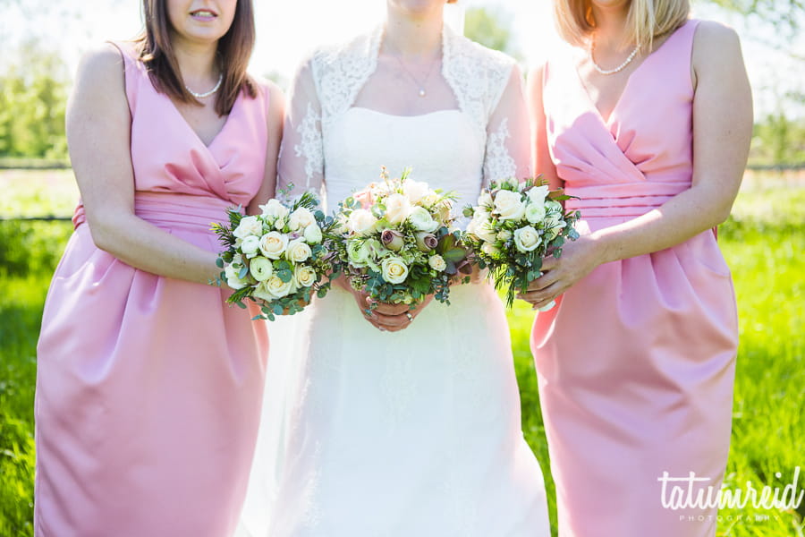 Bride and bridesmaids holding bouquets