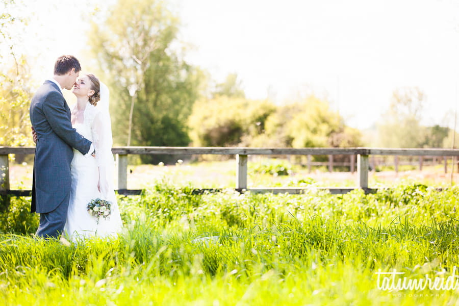 Bride and groom in a field