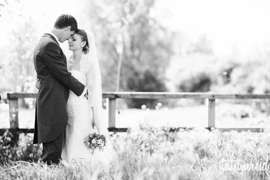 Bride and groom in a field