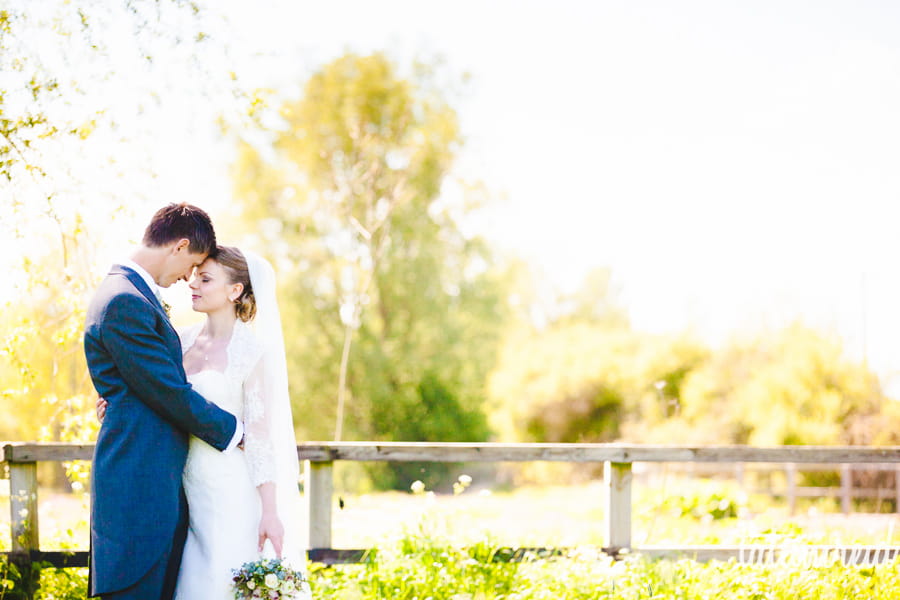 Bride and groom in a field