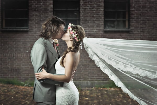 Bride and groom kissing