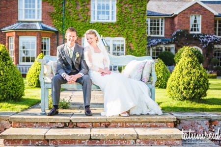 Bride and groom on bench